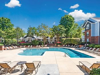Poolside Relaxing Area at The Village Apartments, North Carolina